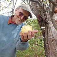John Bunker showing an apple